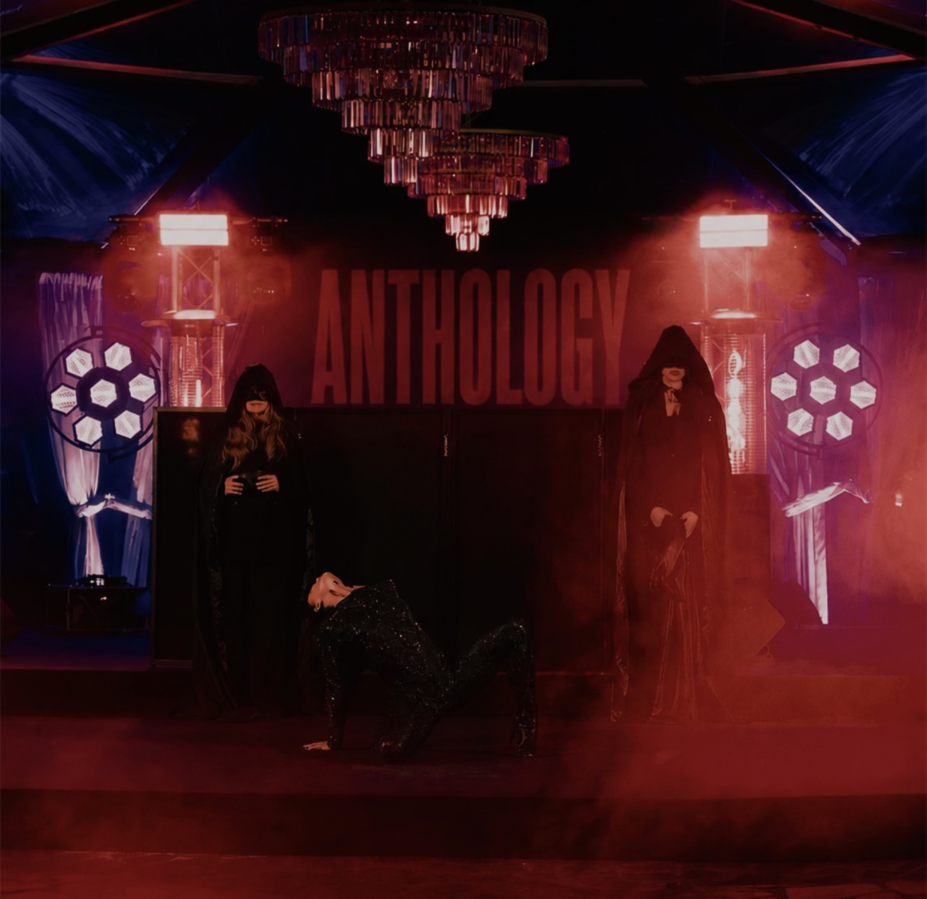 Backstage moment beneath the Anthology stage sign