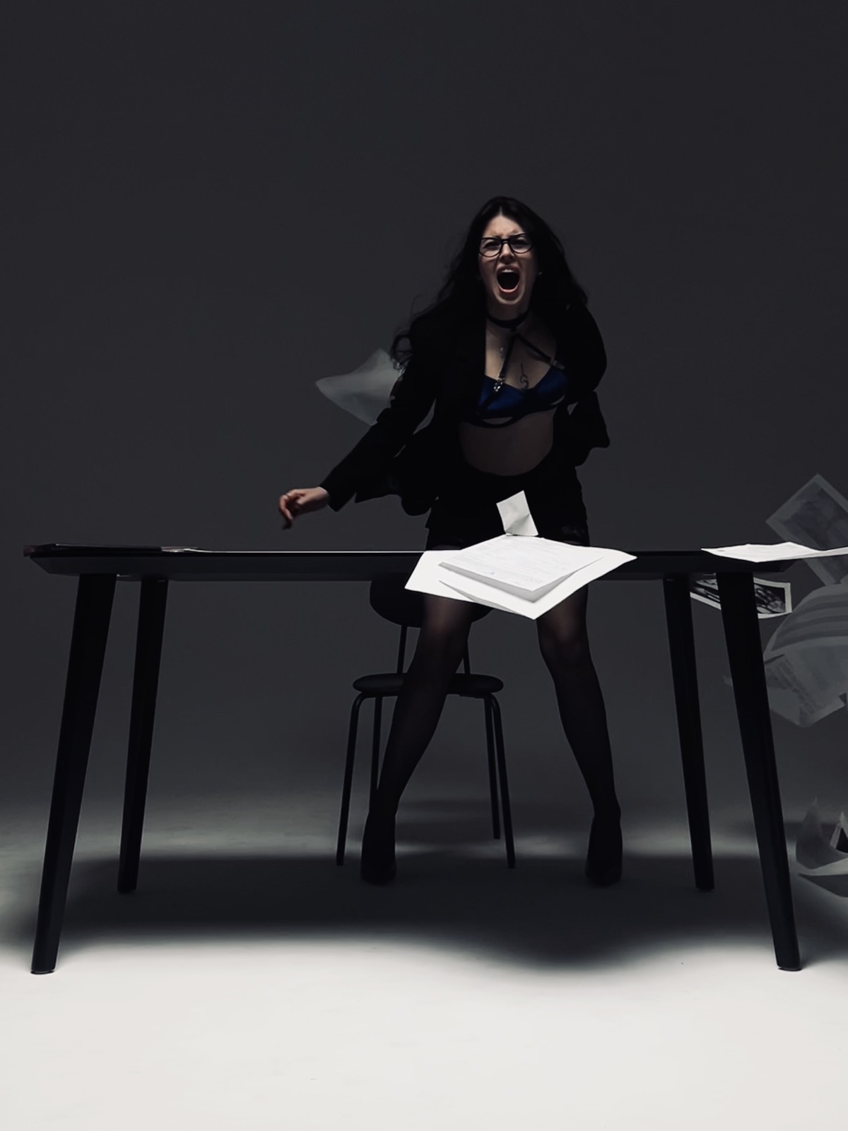 Studio performance portrait, dramatic black and white styling